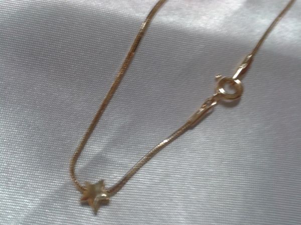 tornozeleira com pingente de estrela